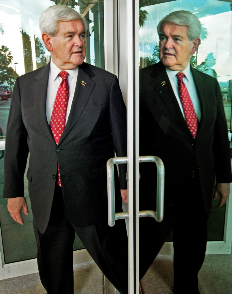DOUBLE TROUBLE: Newt Gingrich takes a moment to reflect on his soaring poll numbers yesterday as he heads for a speech in Tampa.