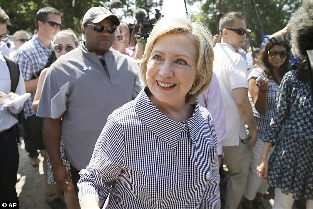 Rising tally: A report suggests State Department Investigators have already found 60 emails sent from Hillary Clinton's private server with classified information on them. She is pictured at the Iowa State Fair