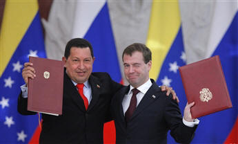Venezuela's Hugo Chavez, left, and Russia's Dmitry Medvedev embrace after reaching a deal in Moscow to build Venezuela's first nuclear plant....