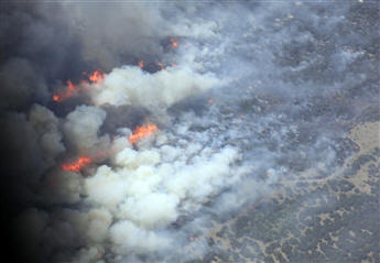 Wildfires flare near Possum Kingdom, Texas, on April 19. The feds still have not declared the state a disaster area.