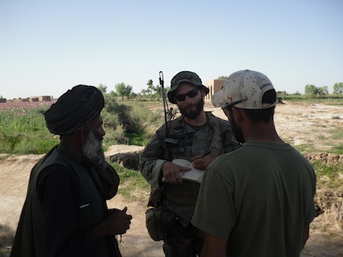 Special Forces Captain Matt Golsteyn, center, talks to Afghan villager, April 2010 / Author photo
