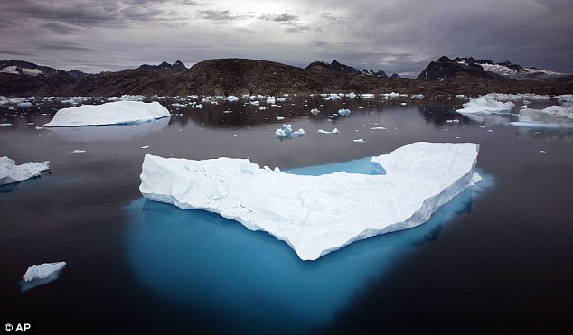 Warmer: Since 1880 the world has warmed by 0.75 degrees Celsius. This image shows floating icebergs in Greenland