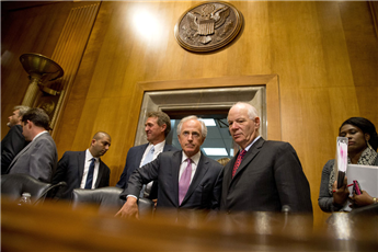 Foreign Relations Committee Chairman Sen. Bob Corker, R-Tenn., center, speaks with the committee's ranking member Sen. Ben Cardin, D-Md., on Capitol...