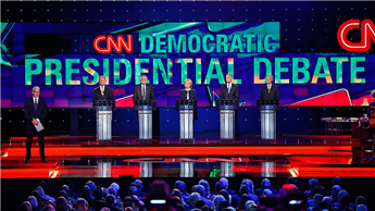 Democratic presidential candidates take the stage before the CNN Democratic presidential debate in Las Vegas on Tuesday. AP
