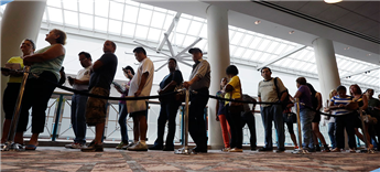 People wait in line to sign up for unemployment in Atlantic City, N.J. AP