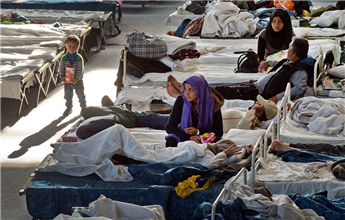 Migrants rest in a shelter in Hanau, Germany, on Thursday.  AP