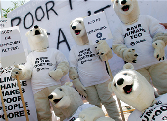Environmental activists dressed as polar bears demonstrate outside the United Nations Climate Conference in Nusa Dua, Bali, Indonesia, on  Dec. 14,...