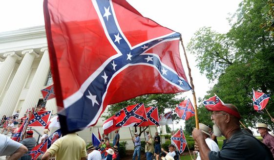 Supporters gather for a rally to protest the removal of Confederate flags from the Confederate Memorial Saturday, June 27, 2015, in Montgomery, Ala.   (Julie Bennett/AL.com via AP) MAGS OUT; MANDATORY CREDIT